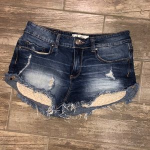 Dark wash jean shorts w/ shiny lace pockets